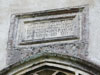 Tablet dated 1555 above East window
